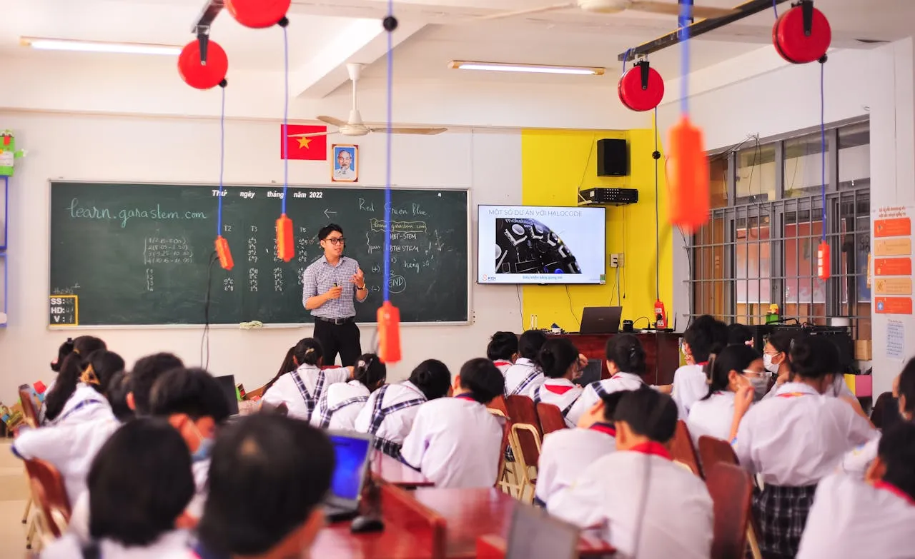 Teacher working with students in an elementary classroom